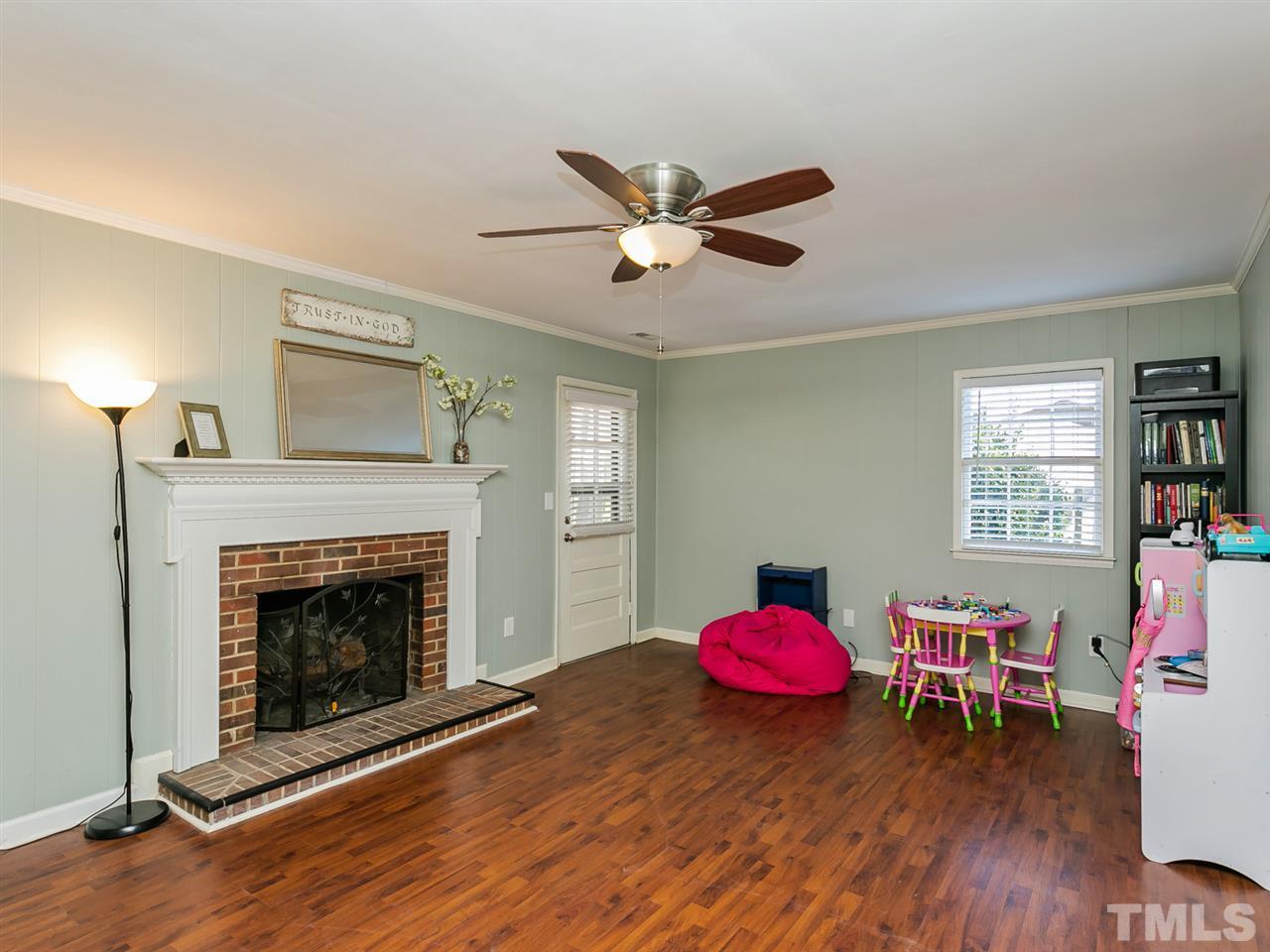 7705 Prospector Place Raleigh, NC 27615 - Photo 17 of 30 a living room with furniture and a fireplace