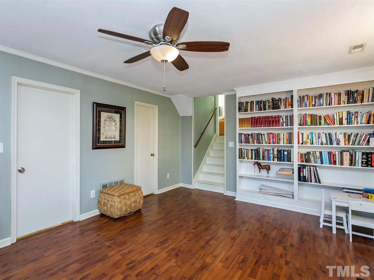 7705 Prospector Place Raleigh, NC 27615 - Photo 18 of 30 a view of an empty room with wooden floor and a window