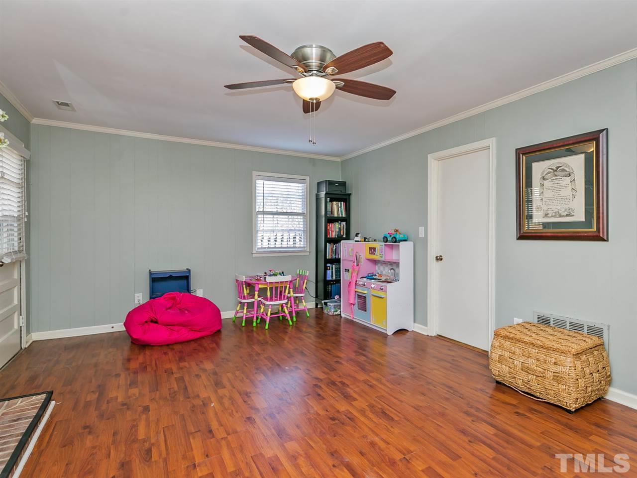 7705 Prospector Place Raleigh, NC 27615 - Photo 19 of 30 a living room with furniture and wooden floor