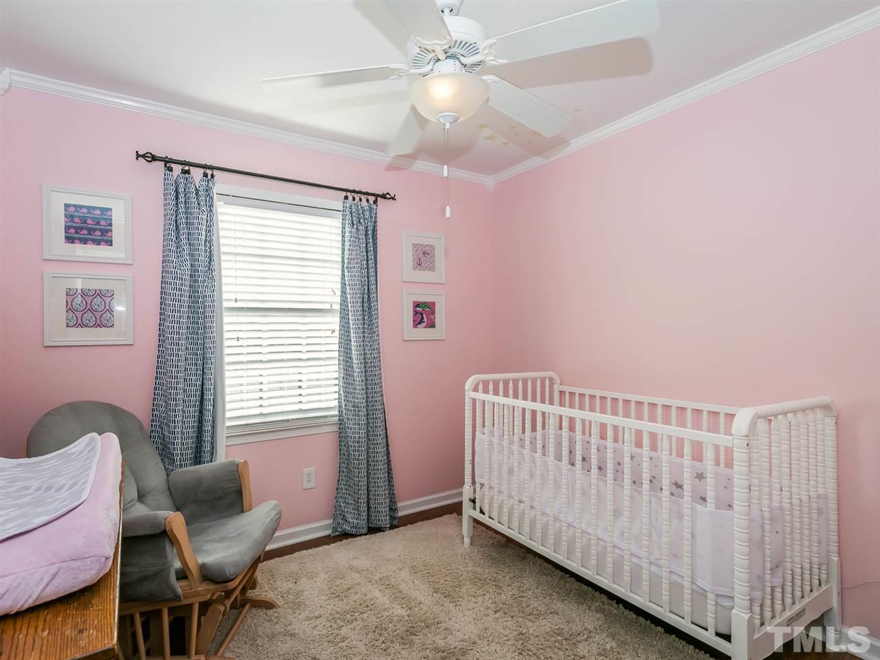 7705 Prospector Place Raleigh, NC 27615 - Photo 21 of 30 a bedroom with furniture and windows