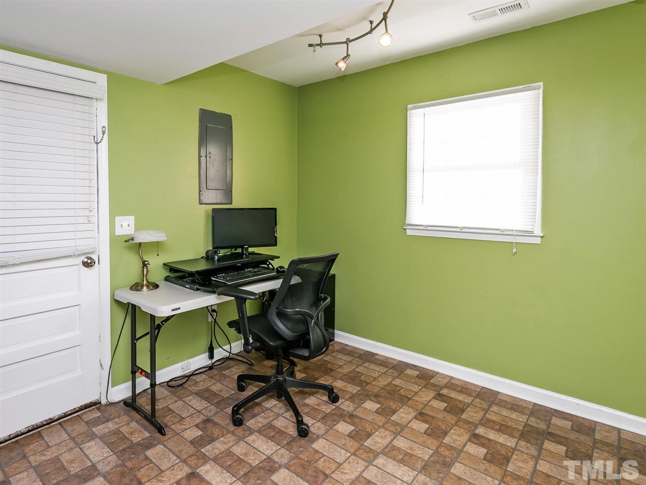 7705 Prospector Place Raleigh, NC 27615 - Photo 24 of 30 a workspace with furniture and a window