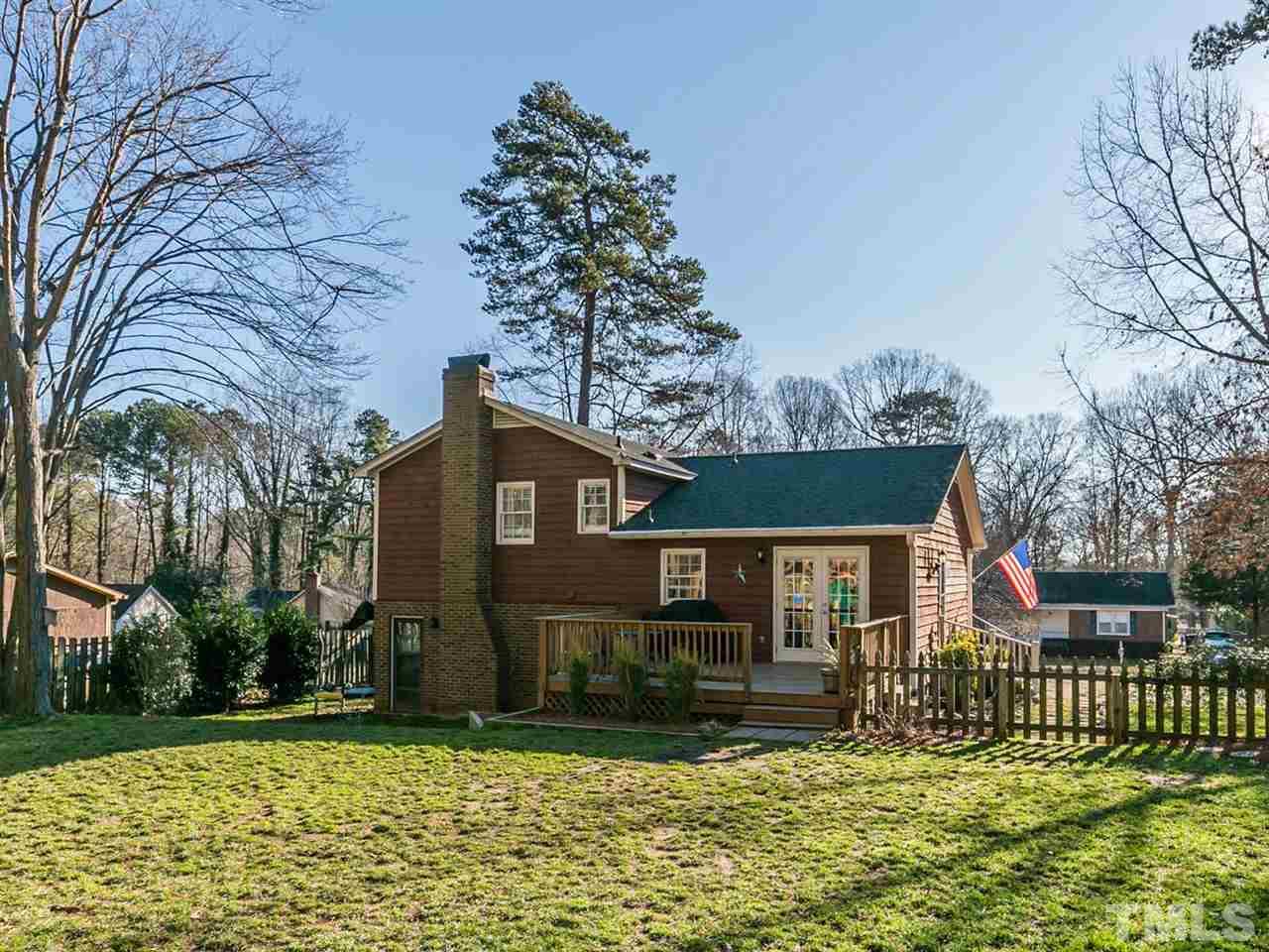 7705 Prospector Place Raleigh, NC 27615 - Photo 4 of 30 front view of a house with a yard