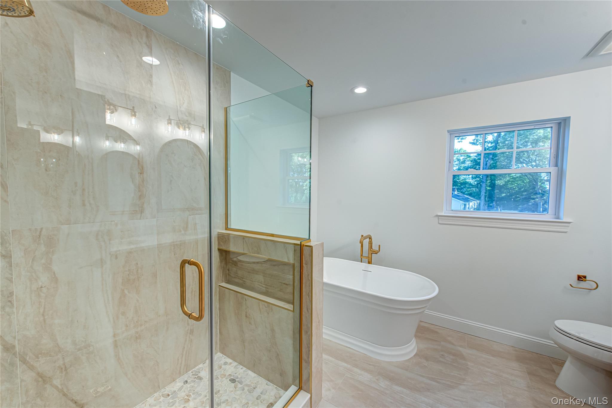 64 Blydenburgh Road Centereach, NY 11720 - Photo 37 of 44 Full bathroom featuring a shower stall, a freestanding tub, and recessed lighting. For Marketing Purposes!