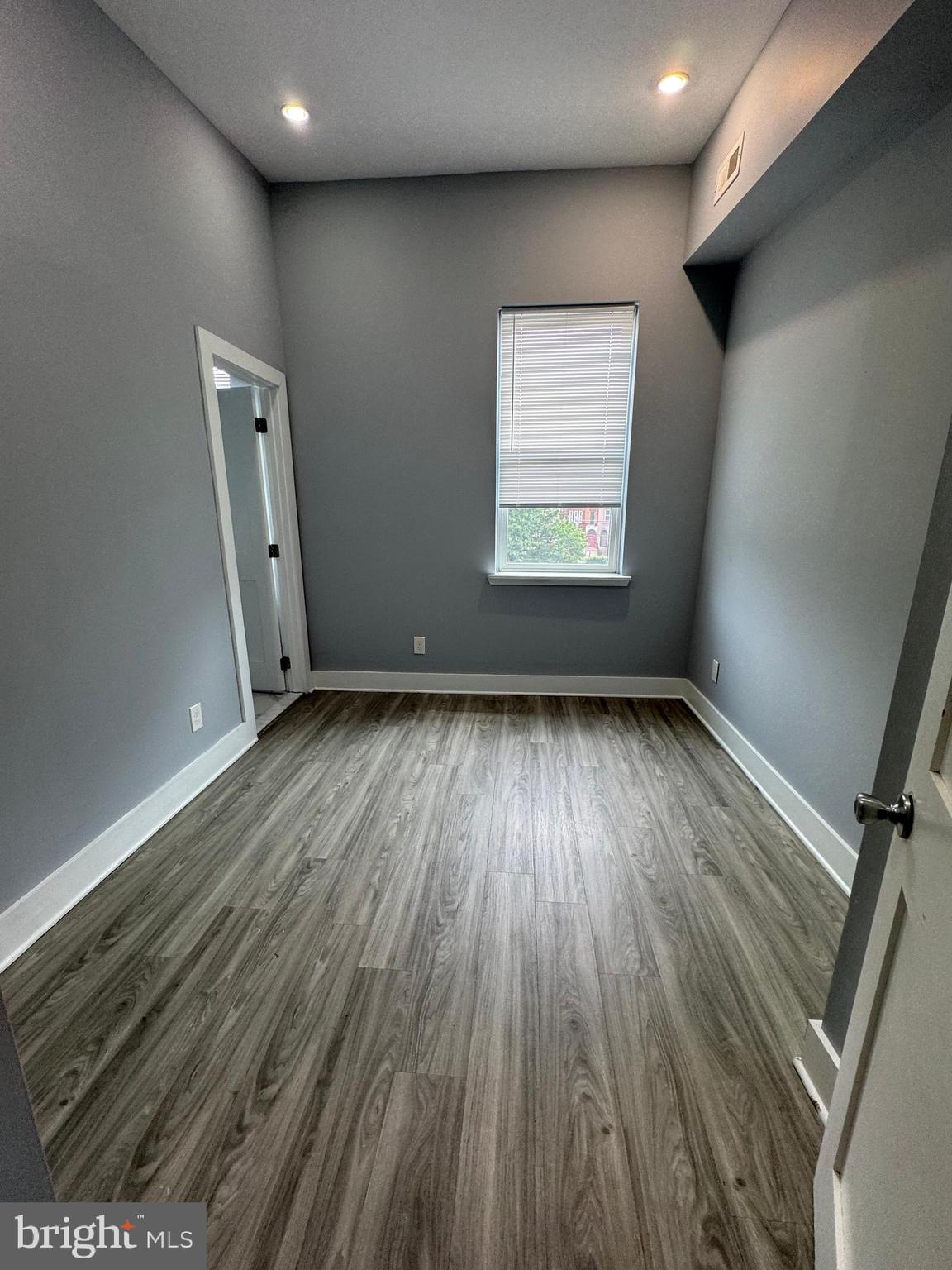 1522 Willington Street, Unit 2 Philadelphia, PA 19121 - Photo 12 of 29 an empty room with wooden floor and windows