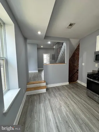 a view of entryway with wooden floor