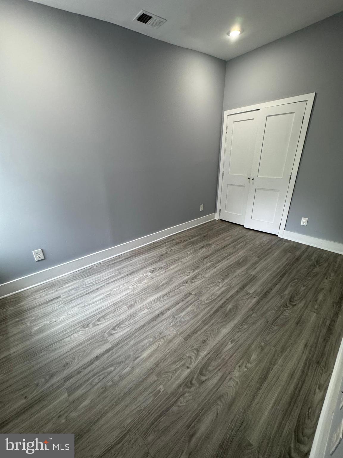 1522 Willington Street, Unit 2 Philadelphia, PA 19121 - Photo 8 of 29 an empty room with wooden floor and cabinet