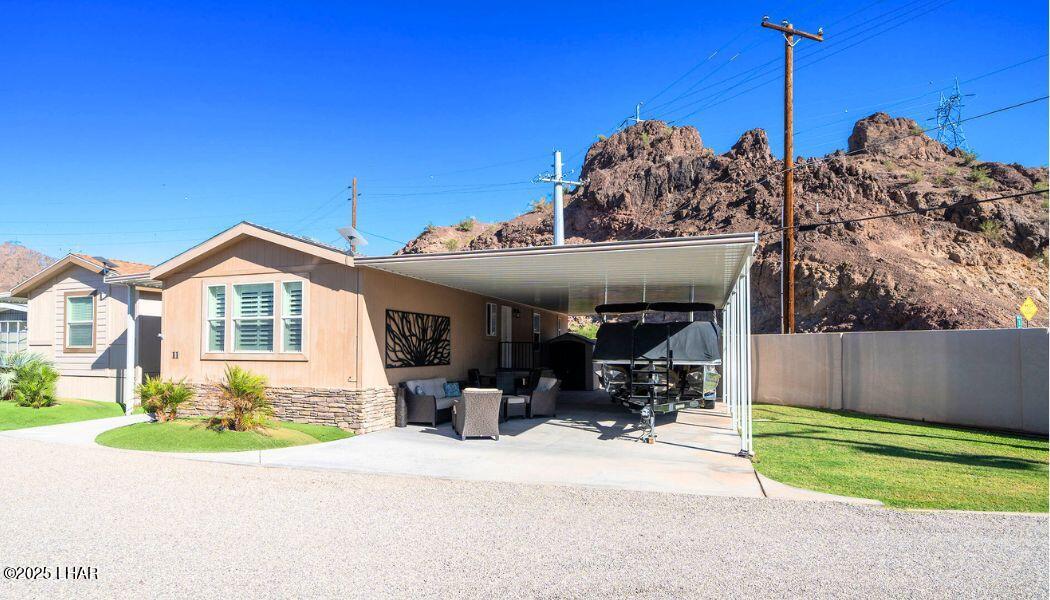 3020 Parker Dam Road, Unit 11 Parker, AZ 85344 - Photo 1 of 58 a view of a house with a outdoor space