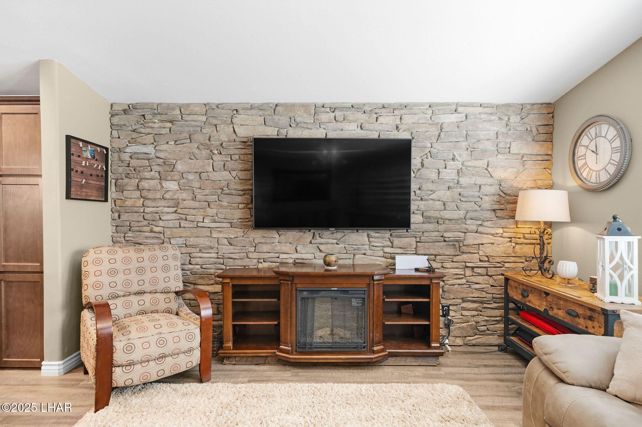 3020 Parker Dam Road, Unit 11 Parker, AZ 85344 - Photo 14 of 58 a living room with fireplace furniture and a flat screen tv
