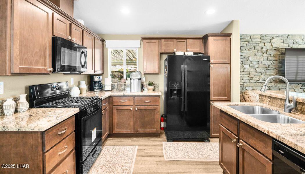 3020 Parker Dam Road, Unit 11 Parker, AZ 85344 - Photo 18 of 58 a kitchen with stainless steel appliances granite countertop a refrigerator stove and sink