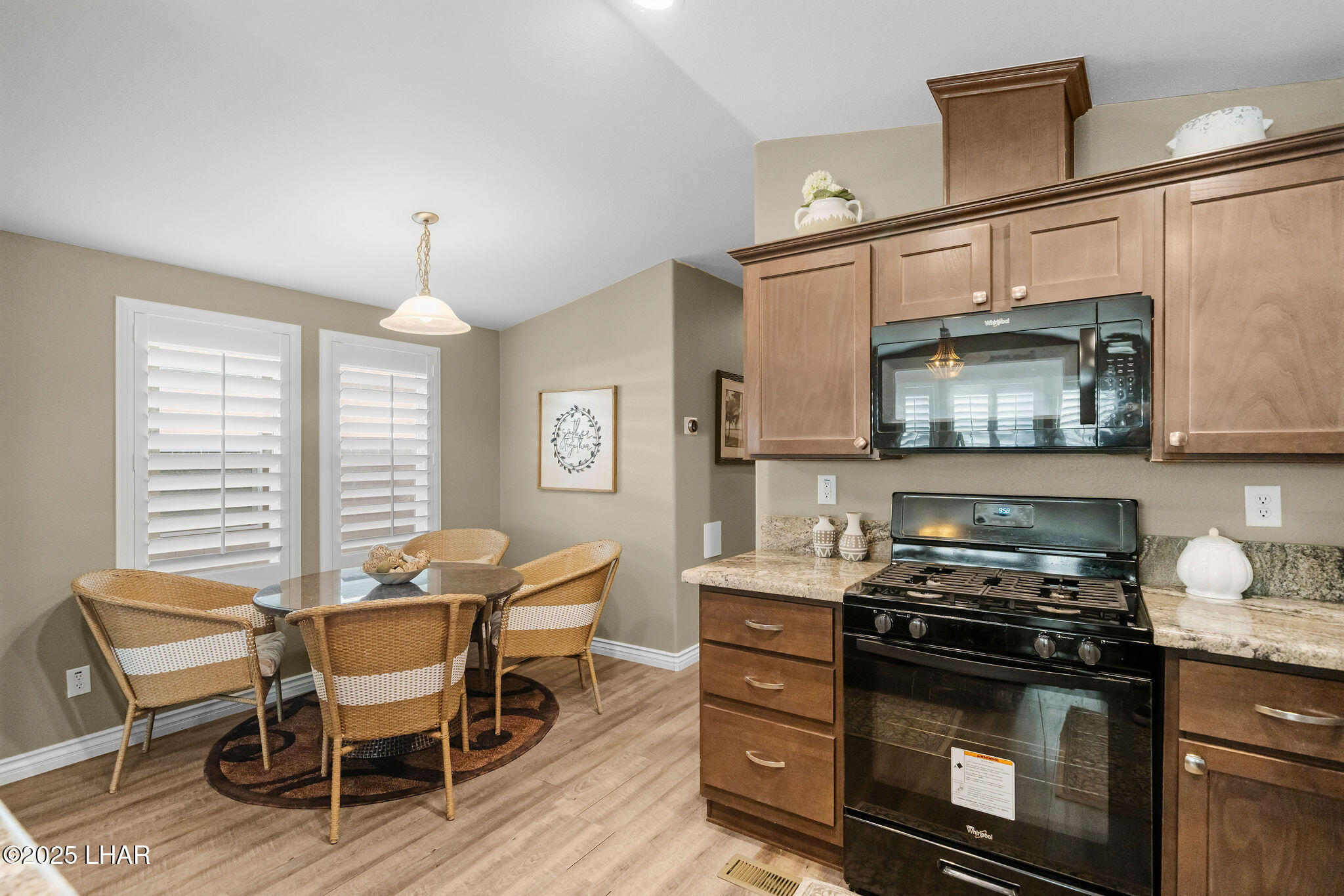 3020 Parker Dam Road, Unit 11 Parker, AZ 85344 - Photo 21 of 58 a kitchen with a stove and a wooden floor