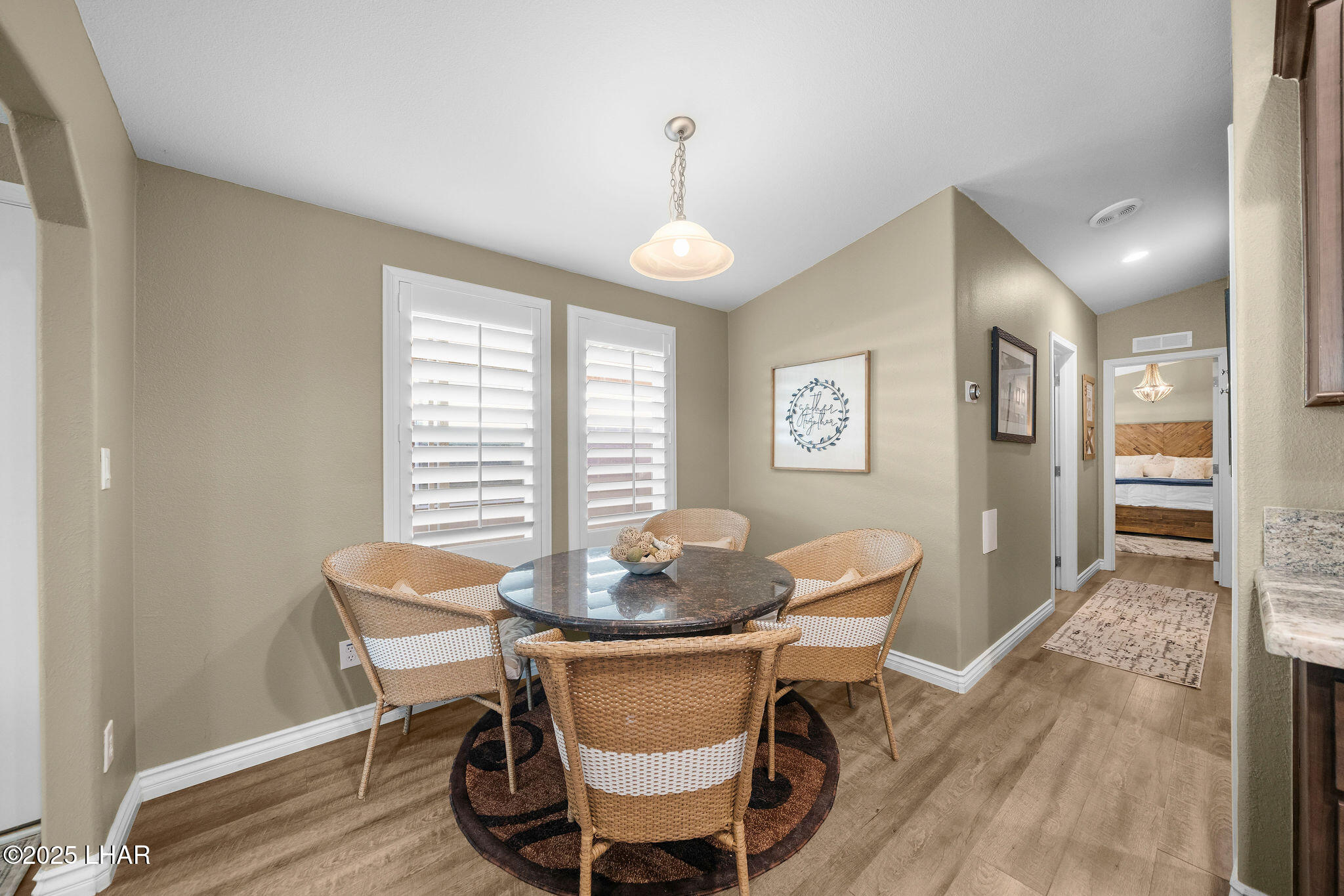 3020 Parker Dam Road, Unit 11 Parker, AZ 85344 - Photo 22 of 58 a dining room with furniture a chandelier and wooden floor