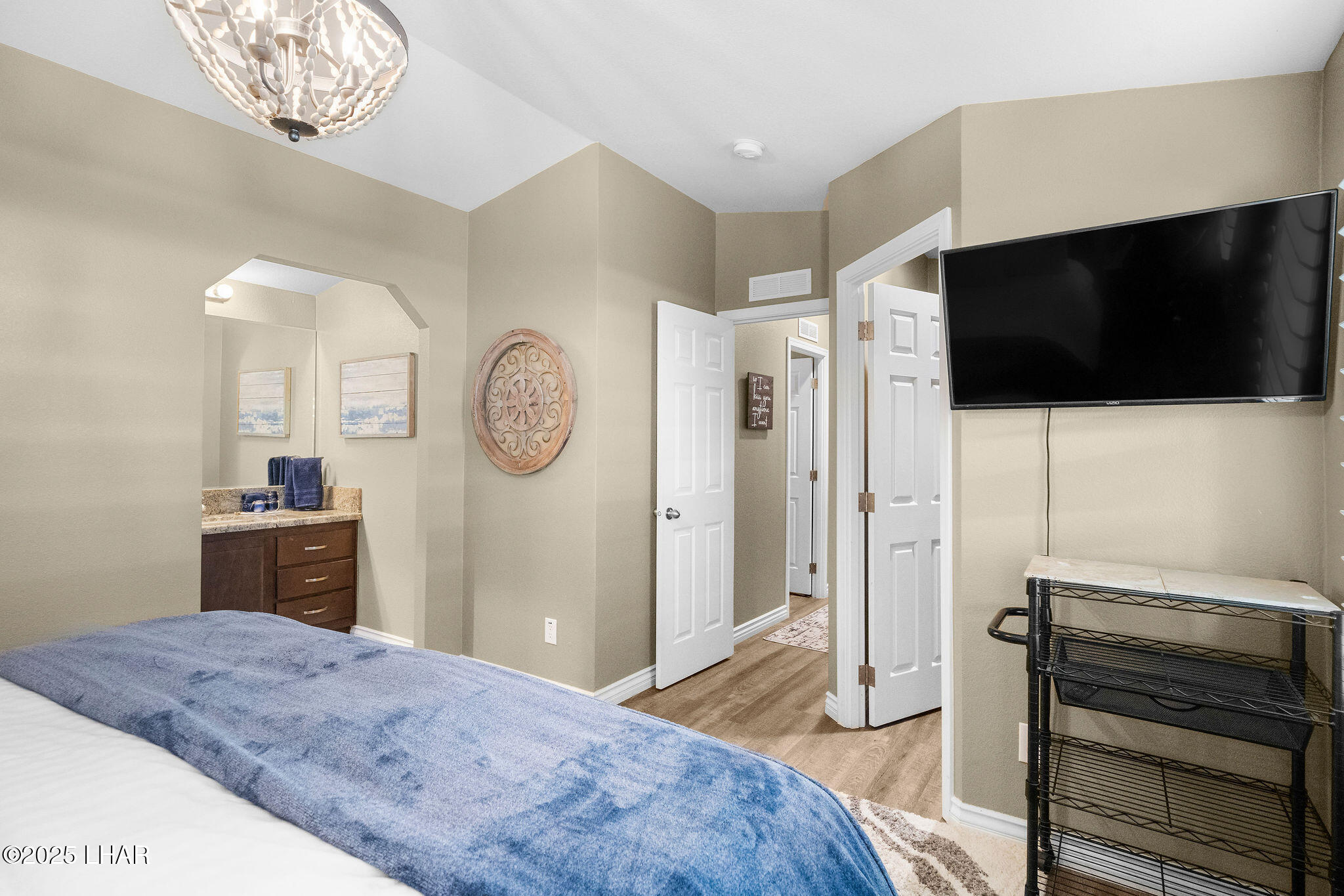 3020 Parker Dam Road, Unit 11 Parker, AZ 85344 - Photo 26 of 58 a bedroom with a bed and a television in it