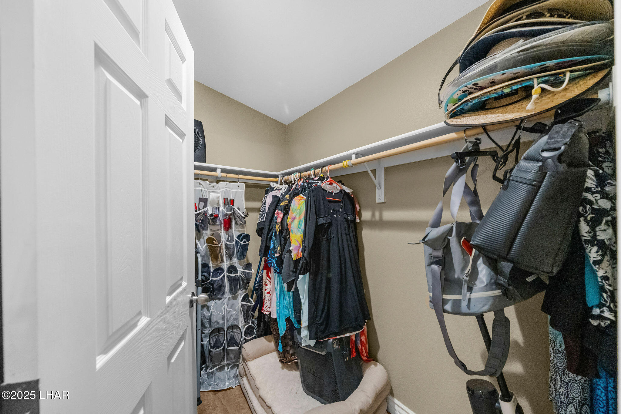 3020 Parker Dam Road, Unit 11 Parker, AZ 85344 - Photo 27 of 58 a view of walk in closet with clothes and shoes