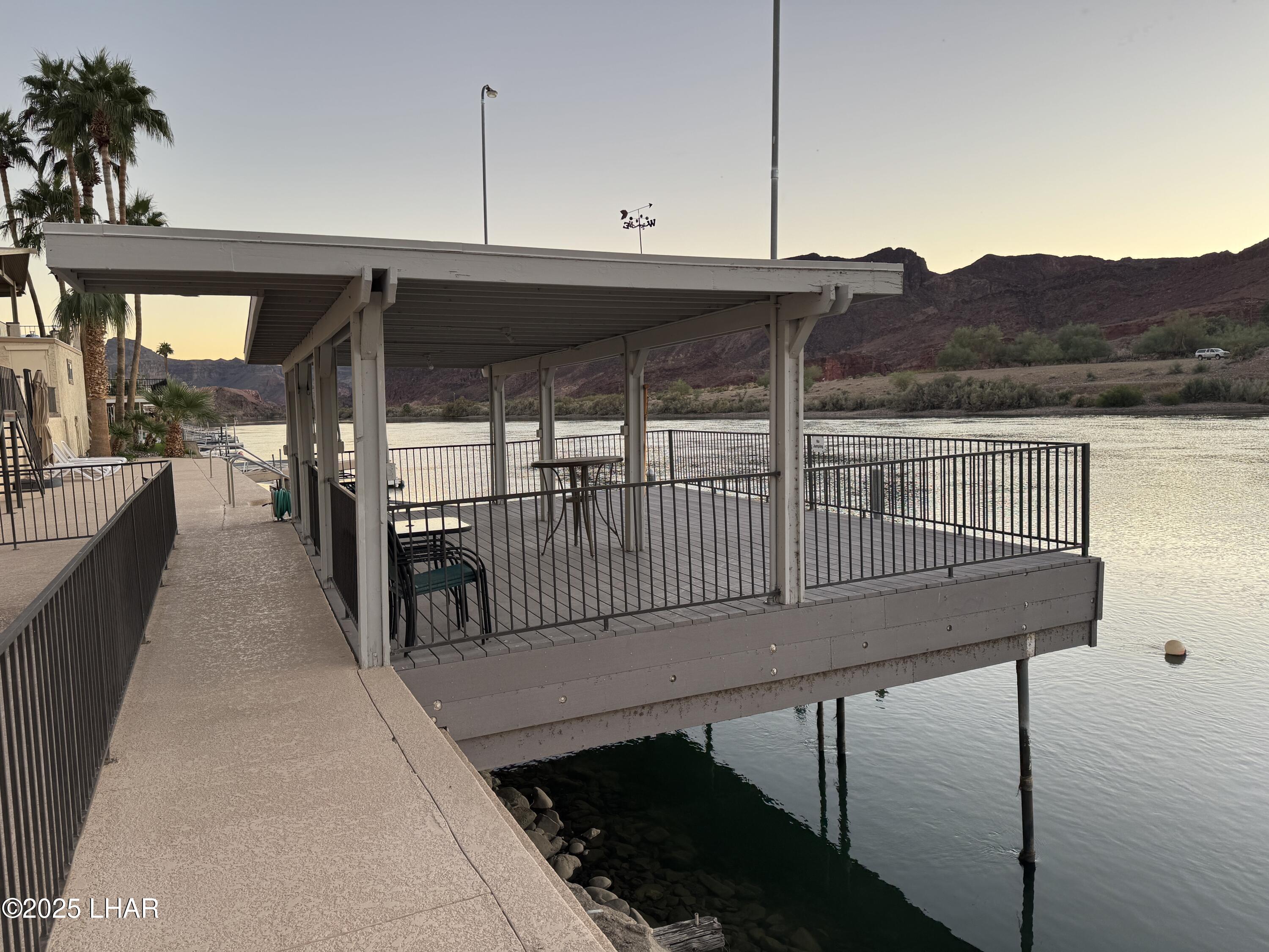 3020 Parker Dam Road, Unit 11 Parker, AZ 85344 - Photo 43 of 58 a view of a balcony and chairs