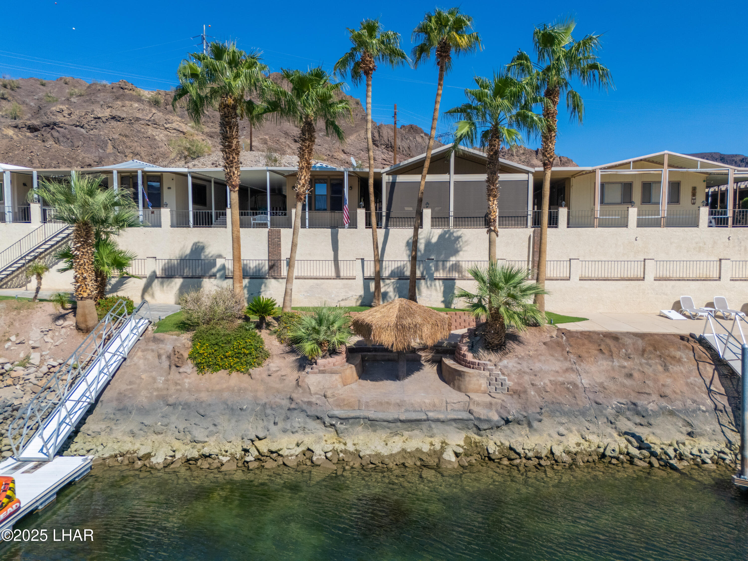 3020 Parker Dam Road, Unit 11 Parker, AZ 85344 - Photo 51 of 58 a front view of a house with a garden