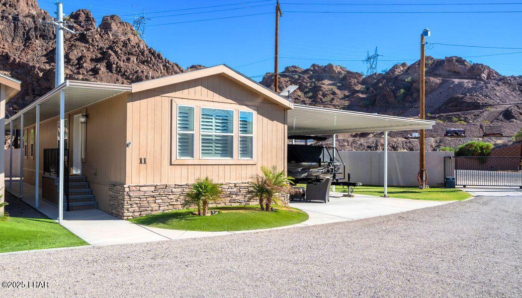 3020 Parker Dam Road, Unit 11 Parker, AZ 85344 - Photo 8 of 58 a front view of a house with garden