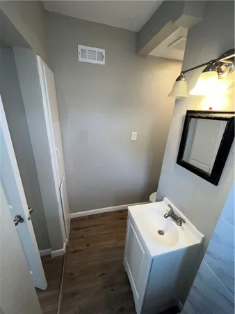 a bathroom with a sink and mirror