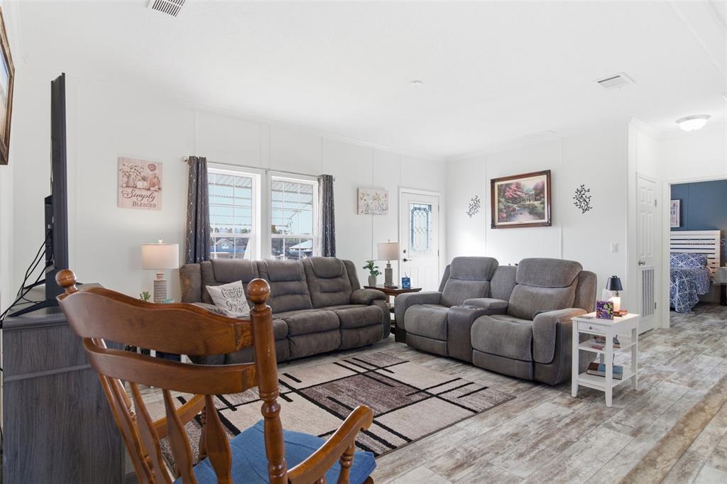 12441 Hexam Road Weeki Wachee, FL 34614 - Photo 11 of 46 a living room with furniture and a window
