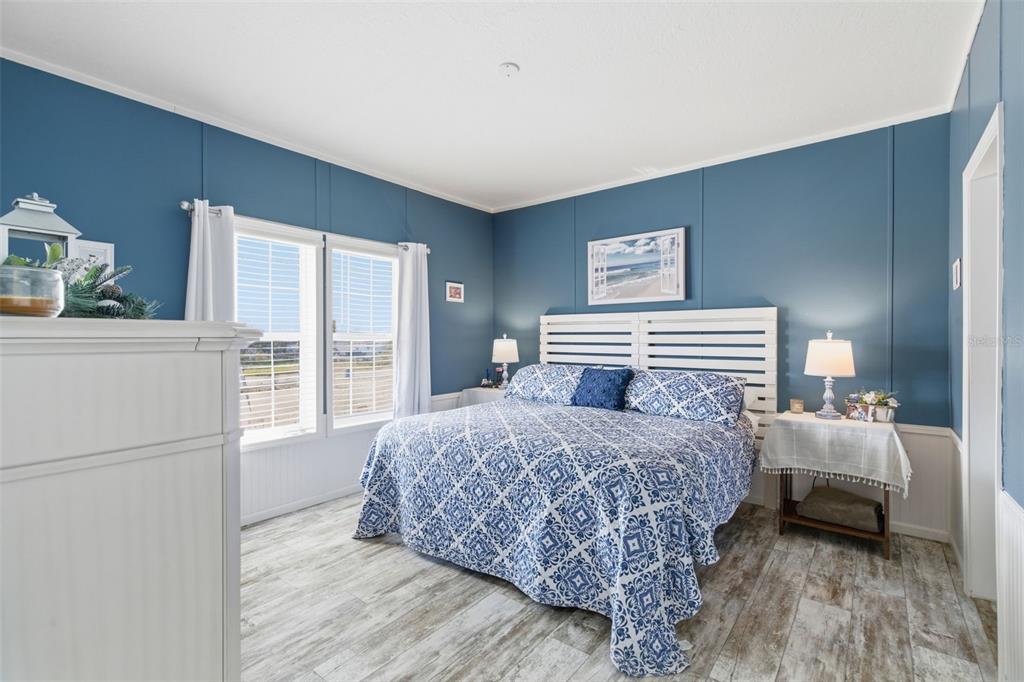 12441 Hexam Road Weeki Wachee, FL 34614 - Photo 20 of 46 a bedroom with bed and large window