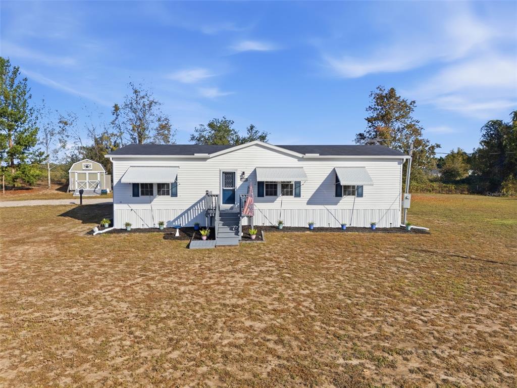 12441 Hexam Road Weeki Wachee, FL 34614 - Photo 2 of 46 an arial view of a house with a yard