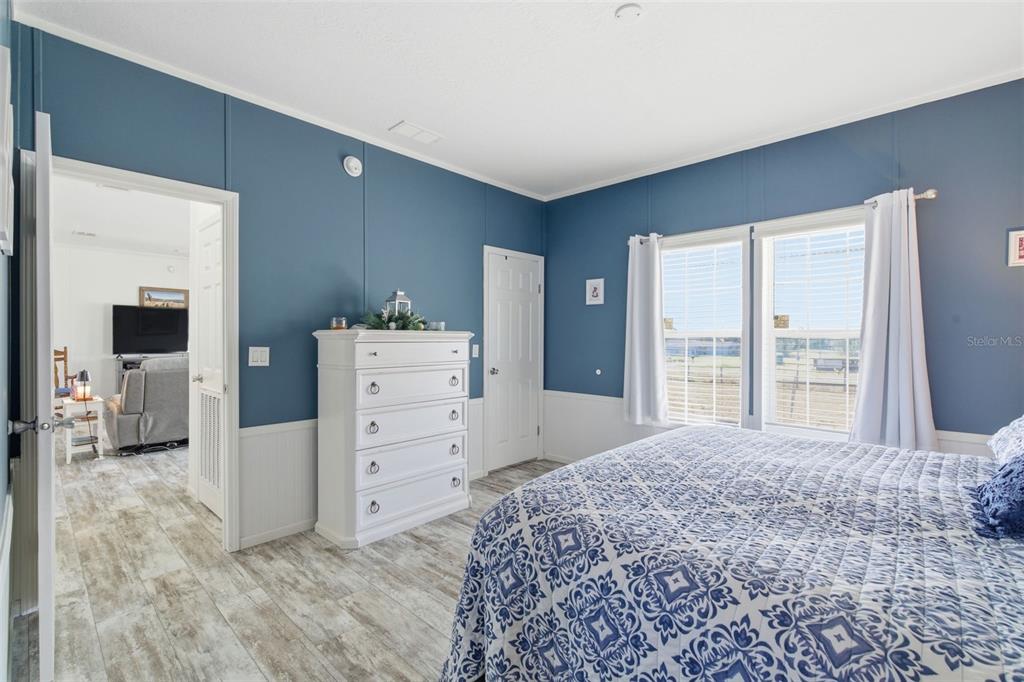 12441 Hexam Road Weeki Wachee, FL 34614 - Photo 21 of 46 a bedroom with a bed and a dresser