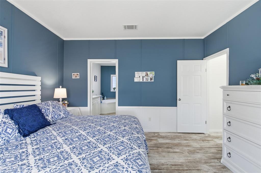 12441 Hexam Road Weeki Wachee, FL 34614 - Photo 22 of 46 a bedroom with a bed and a cabinets