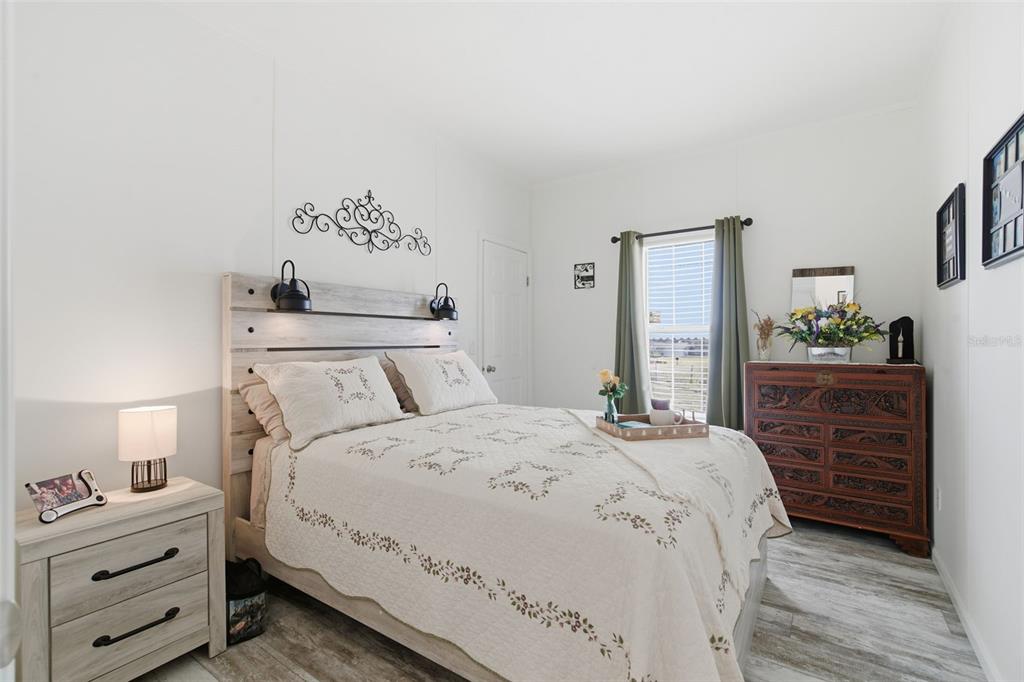 12441 Hexam Road Weeki Wachee, FL 34614 - Photo 23 of 46 a bedroom with a bed and a closet