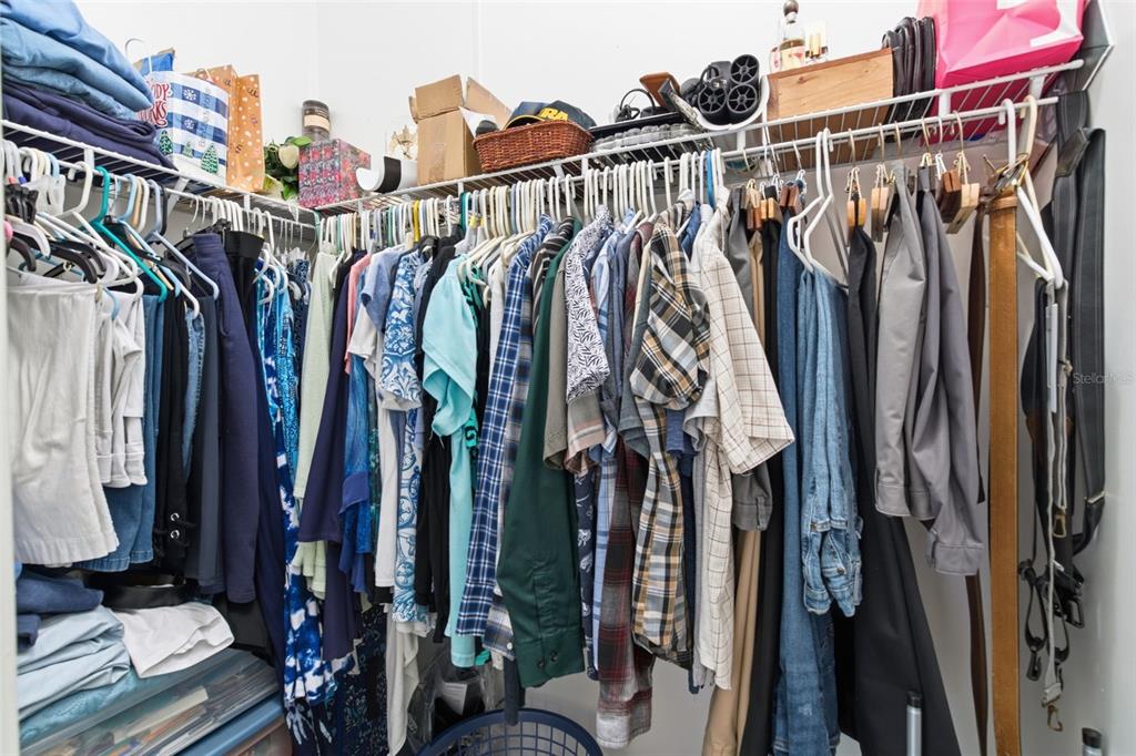 12441 Hexam Road Weeki Wachee, FL 34614 - Photo 25 of 46 a view of walk in closet with clothes