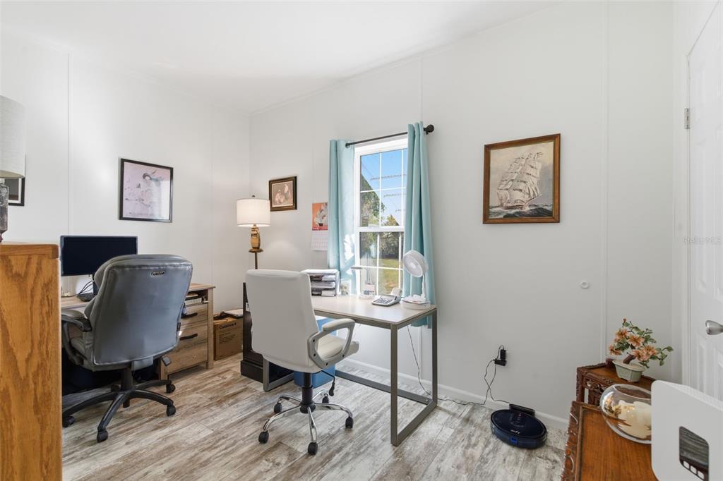 12441 Hexam Road Weeki Wachee, FL 34614 - Photo 28 of 46 a view of a workspace with furniture and a workspace