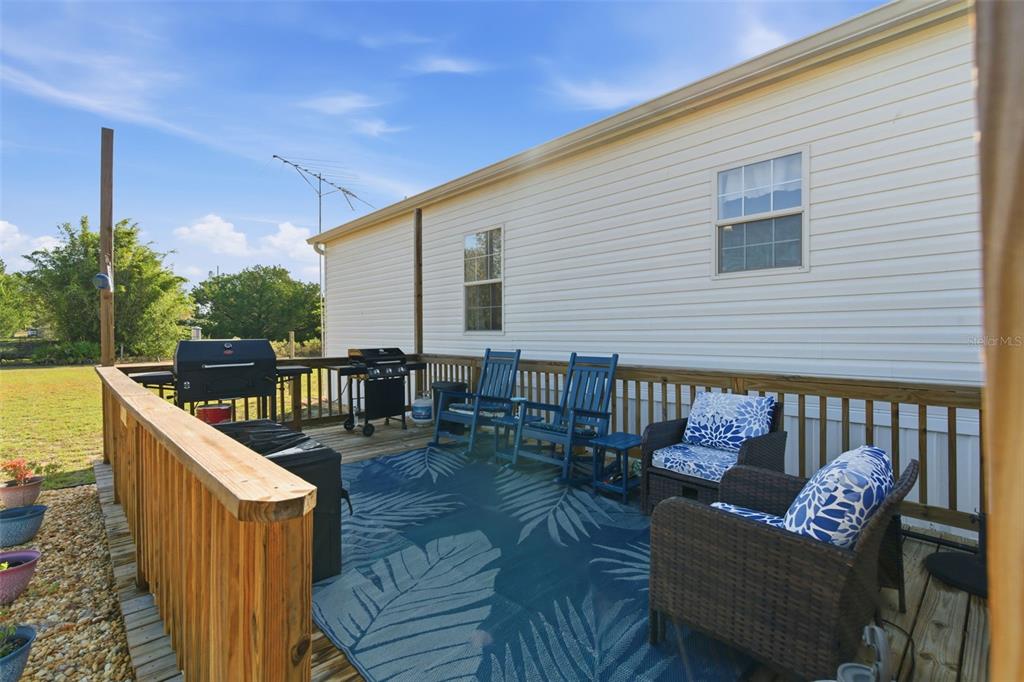 12441 Hexam Road Weeki Wachee, FL 34614 - Photo 31 of 46 a roof deck with wooden floor and fence