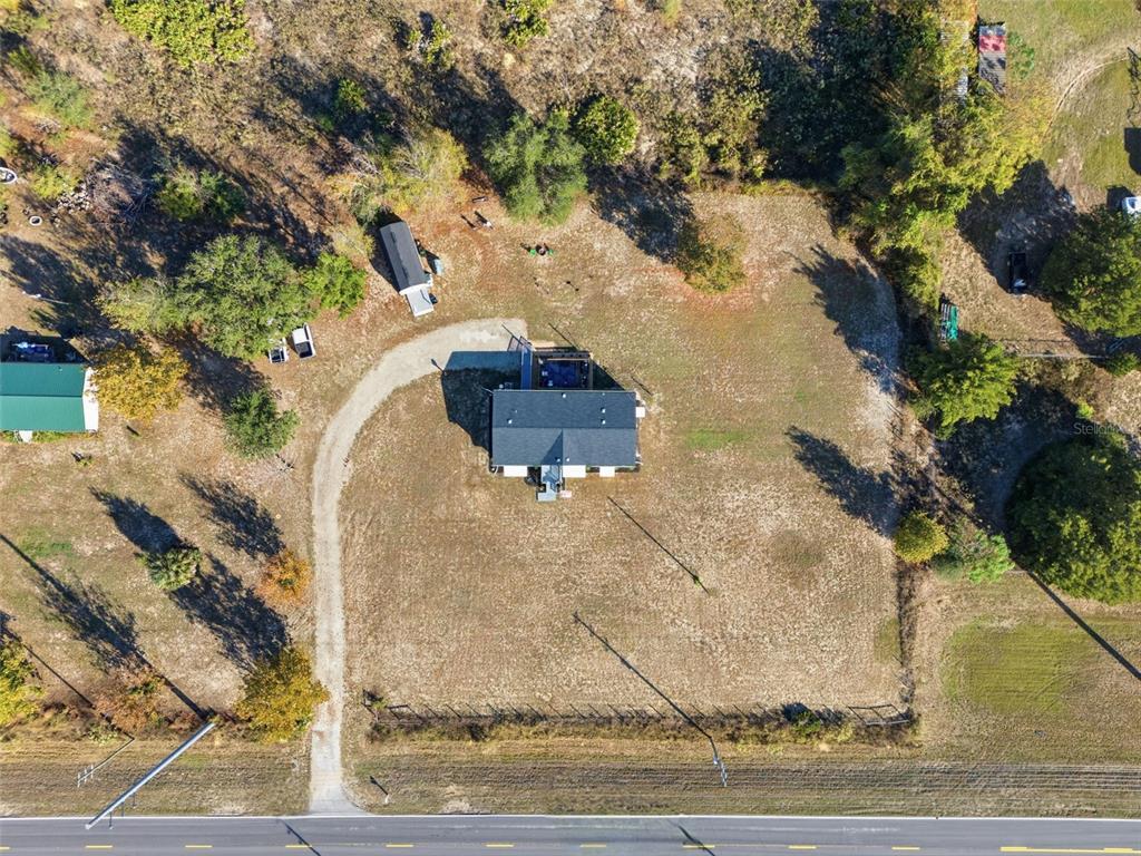 12441 Hexam Road Weeki Wachee, FL 34614 - Photo 33 of 46 a view of a wooden house with a yard