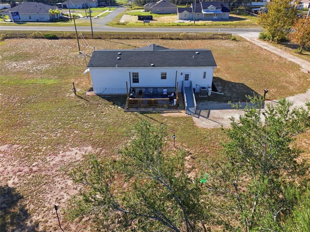 12441 Hexam Road Weeki Wachee, FL 34614 - Photo 40 of 46 a view of a swimming pool with a yard