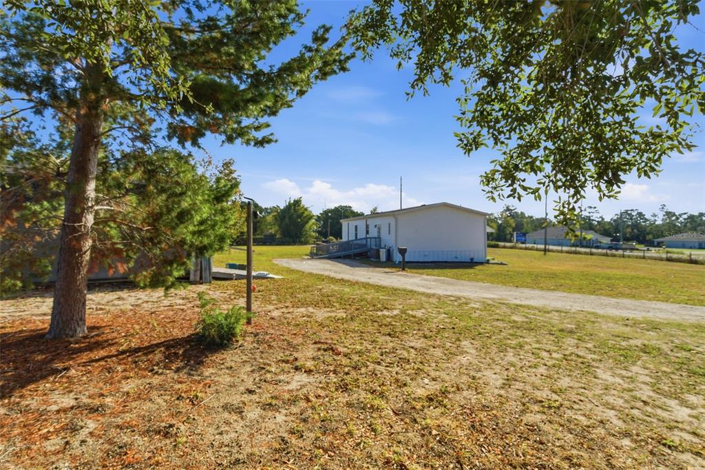 12441 Hexam Road Weeki Wachee, FL 34614 - Photo 44 of 46 a view of a swimming pool with an outdoor space and seating area