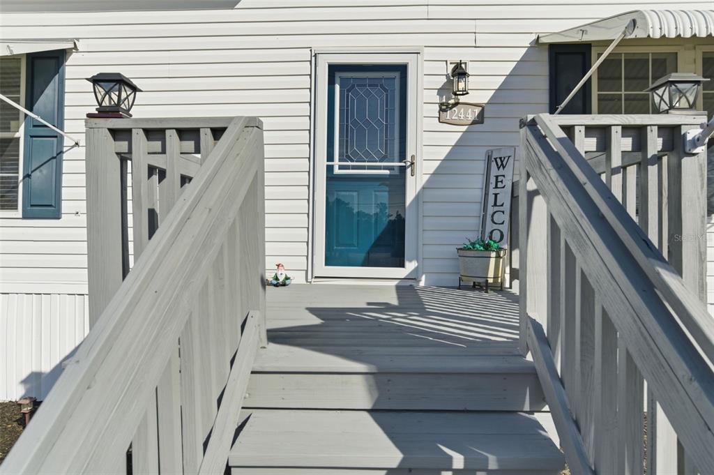 12441 Hexam Road Weeki Wachee, FL 34614 - Photo 7 of 46 a view of entryway with wooden floor and a front door