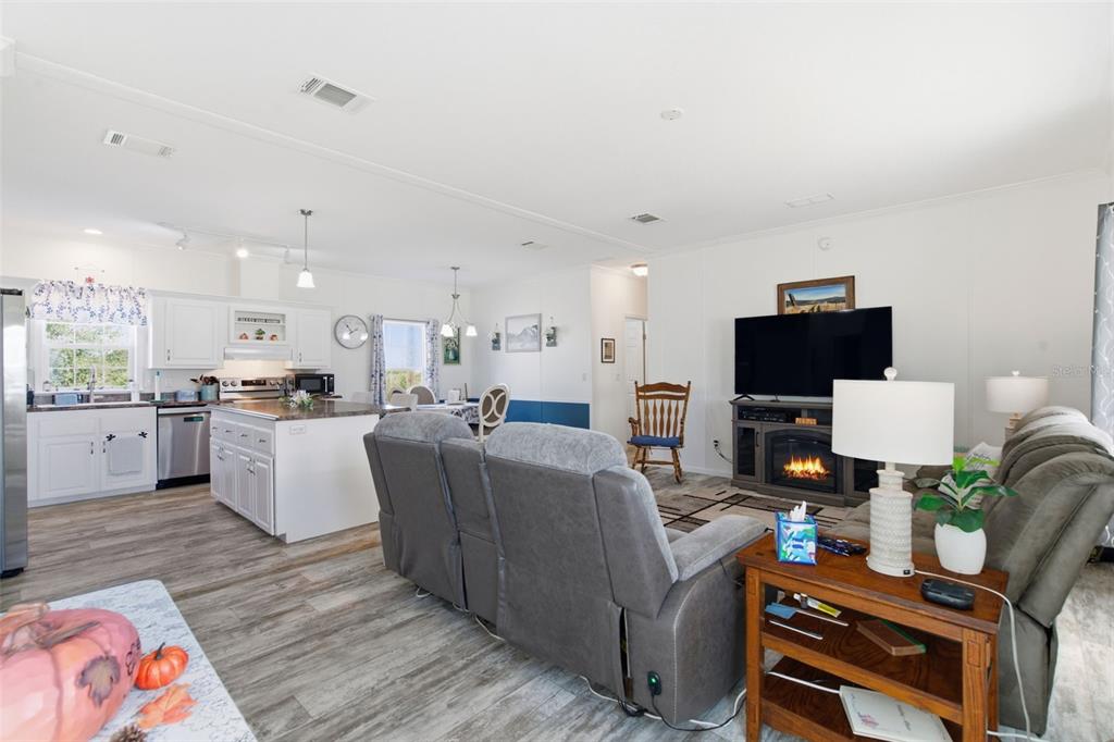 12441 Hexam Road Weeki Wachee, FL 34614 - Photo 10 of 46 a living room with furniture and a flat screen tv