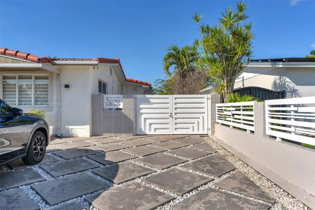 a view of a car in front of a house