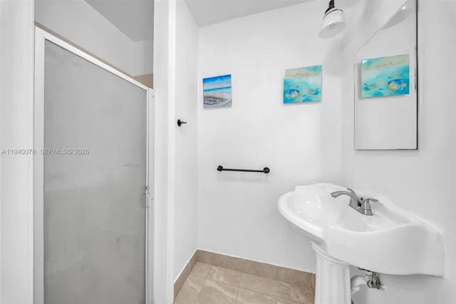 a bathroom with a sink and mirror