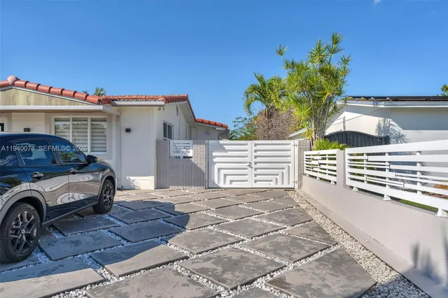 a house view with a backyard space
