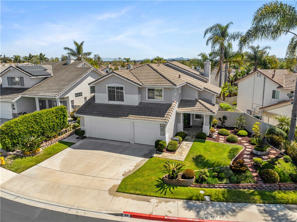 414 Helix Way Oceanside, CA 92057 - Photo 2 of 49 an aerial view of a house with a yard and potted plants