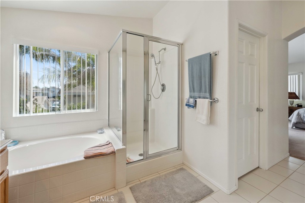 414 Helix Way Oceanside, CA 92057 - Photo 25 of 49 a bathroom with a bathtub and a shower