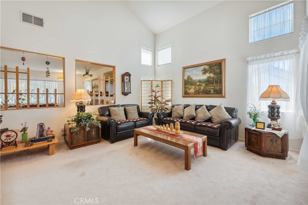 414 Helix Way Oceanside, CA 92057 - Photo 3 of 49 a living room with furniture and a lamp