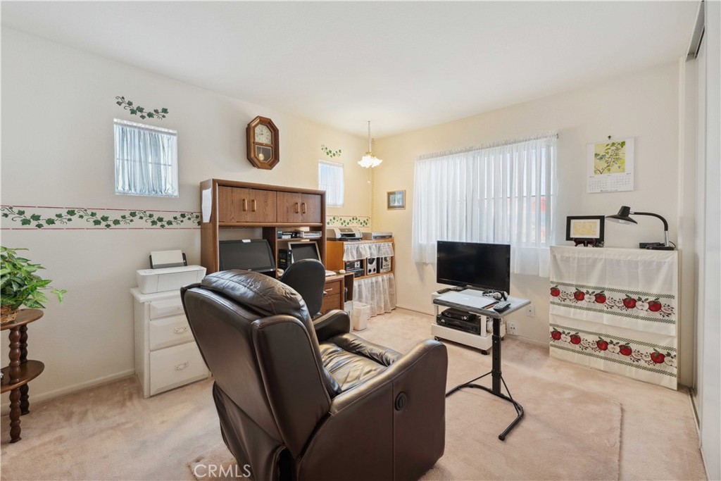 414 Helix Way Oceanside, CA 92057 - Photo 31 of 49 a view of a livingroom with workspace and a couch
