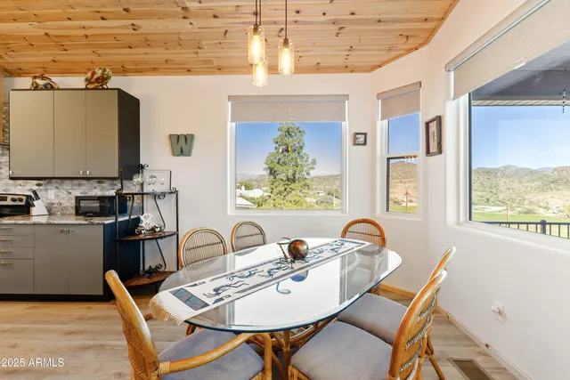 a dining room with furniture and window