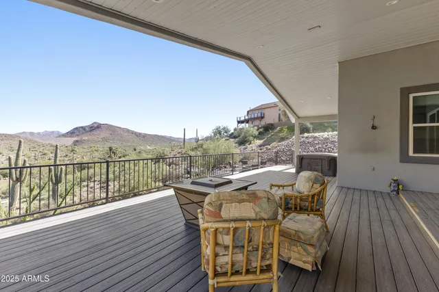 a view of a balcony with furniture