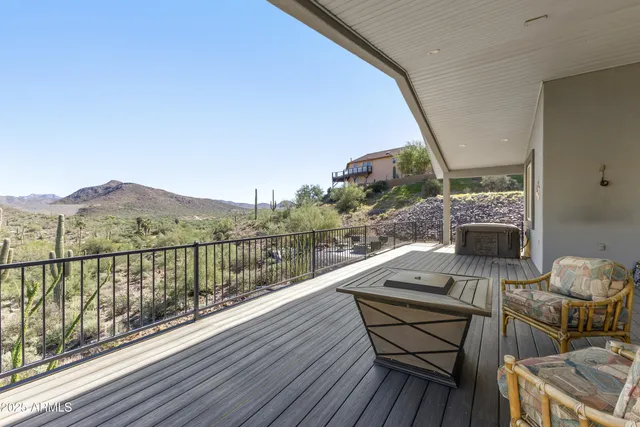 a view of a balcony with chairs
