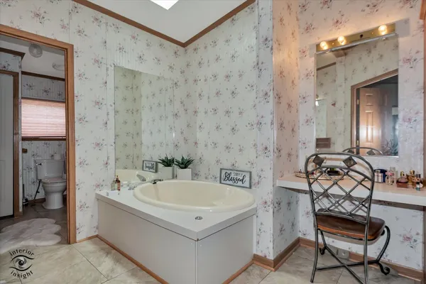 a spacious bathroom with a granite countertop sink mirror and shower