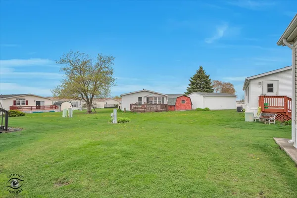 a view of a big yard with a large trees