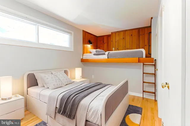 a bedroom with a bed and lamp