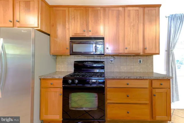 a kitchen with a stove and a microwave