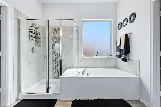 a bathroom with a bathtub and a sink